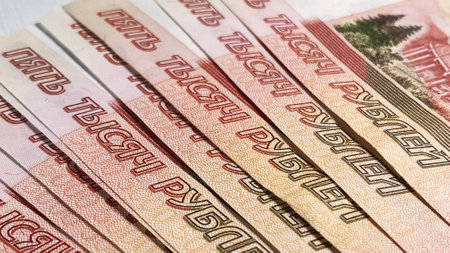 Bank of Russia tickets are fanned out, close-up. Background of cash five thousand ruble notes....