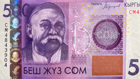 Top view of the 500 SOM bill. Portrait of the poet and manaschi Sayakbaya Karalayeva. The current...