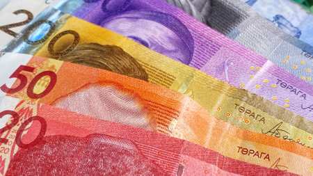 The current money of Kyrgyzstan. Multicolored banknotes in 1000, 500, 200, 50 and 20 som lie on top of each other. Savings of the Kyrgyz. Kyrgyz national currency. Background of Kyrgyz money. economics and finance.の写真素材