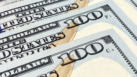 Several $100 bills are in close-up. hundred dollar bills. The American national currency. economics...