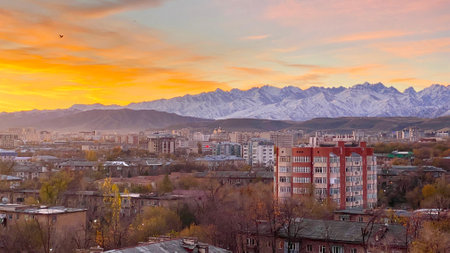 Stunning scenic sunrise in Bishkek city with views of mountain ranges and peaks. Autumn in...