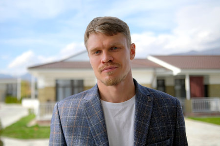 The salesman or the manager is away. Portrait of a confident successful realtor against the...