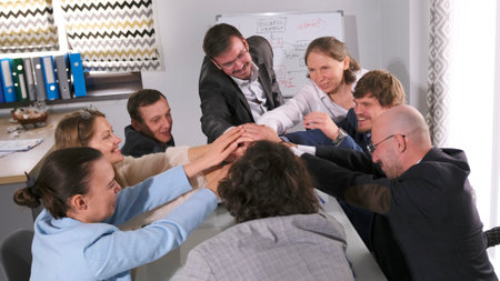 A group of like-minded people is celebrating the successful launch of a business project. The...