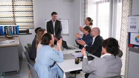 The company of lawyers and advocates celebrates the success of the court session. A group of people...