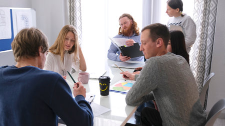 The director of the company discusses the current tasks of the company with his subordinates. A...