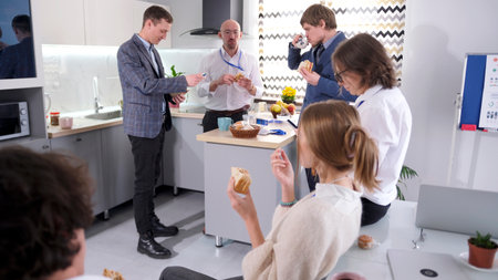 Lunch in the cozy office kitchen. Business lunch at the family office of a consulting company. A...