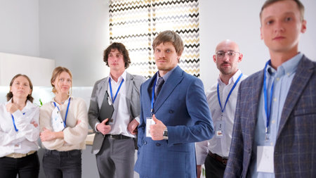 Working for a successful, friendly, young, promising company. A group of men and women in business...