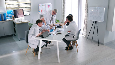 Four doctors in a cozy conference room discuss an unusual case with a patient and develop a...