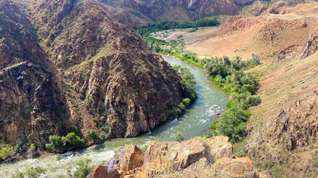 Aerial view of the Charyn River in the picturesque mountain gorge of Kazakhstan. Kara Canyon or Black Canyon. The lifeless amazing nature of Kazakhstan. Landscape is peacefulの写真素材