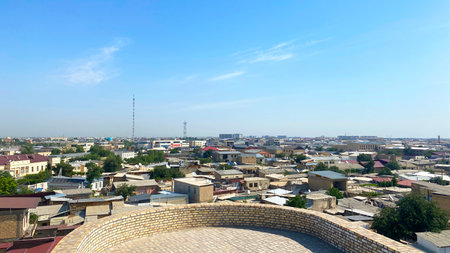 View of Bukhara from the residence of the Bukhara khans and emirs - Ark Fortress. A trip to Uzbekistan. The city is bustling with life, and the sky is clear and blue.の写真素材