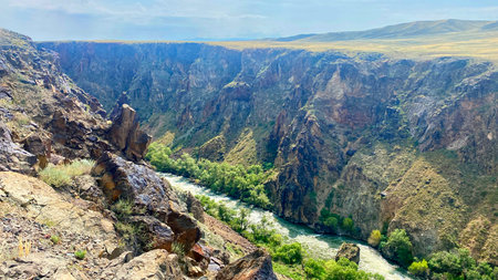 An extraordinary natural monument of Kazakhstan. Black Canyon or Kara Canyon. The mountainous, turbulent Charyn River flows through a rocky, deep gap in the groundの写真素材