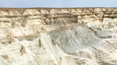 White unique rocky formations in the Bozzhira tract. A desolate, barren landscape in Kazakhstan, Mangystau. Tourism, adventure and travel. The bottom of the ancient Tethys Oceanの写真素材