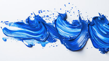 Strokes of blue oil paint in the form of ocean waves. Abstract textural strokes of blue ink on a white background. A backdrop for the design. The blue color of the wave and the drops of paint create the impression of a dynamic and lively scene. The patternの素材
