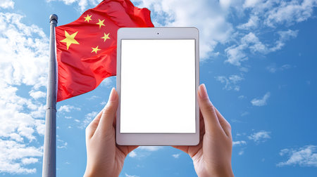 The concept of a website or application about the history of China. A mockup of a tablet in women's hands against the background of the Chinese flag in a blue sky with white clouds. Discounts, promotions, and sales. Online shopping.の素材