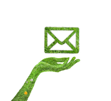 Symbol grass email. Conceptual image of green plant shaped like email signの写真素材