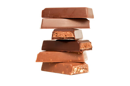 pieces of broken chocolate on white background