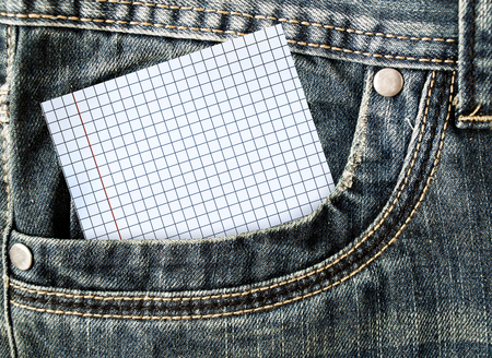 A little note in the side pocket of jeans. White card in jeans pocketの写真素材