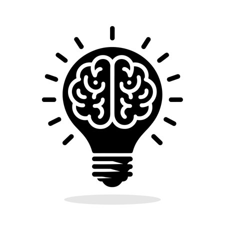Brain in light bulb silhouette with rays on white background. Symbol of creativity and creative idea. Education concept. Vector illustrationのイラスト素材
