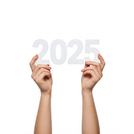 Hands holding the number 2025, isolated on a white background.