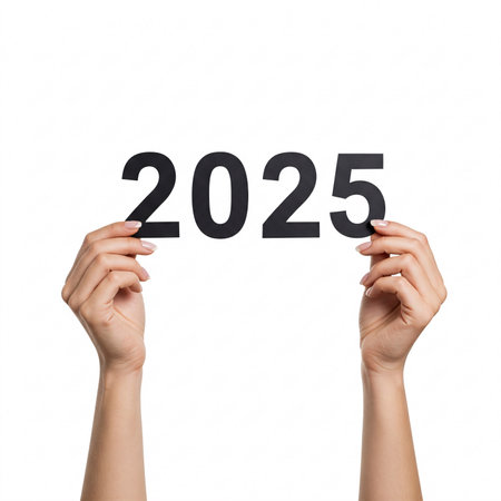 Hands holding the number 2025, isolated on a white background.