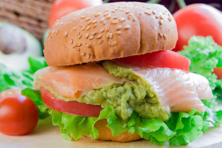 Burger with salmon ang guacamole original  recipeの写真素材