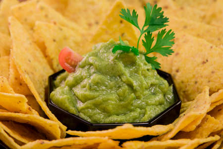 Sauce guacamole with nachosの写真素材