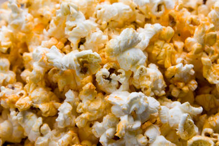 The cheesy popcorn top view backgroundの写真素材