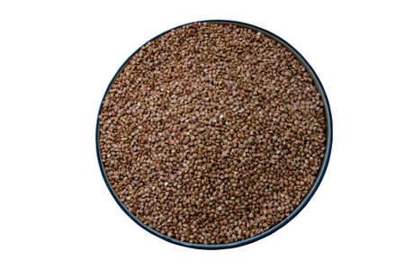 Dried buckwheat in a plate on a white backgroundの写真素材