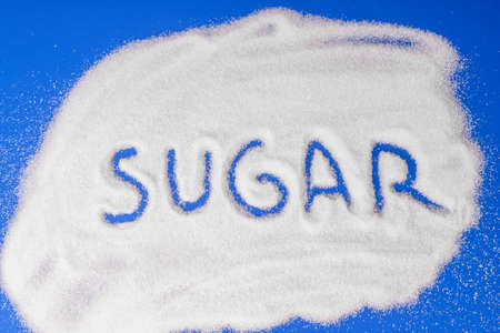 The word sugar written in sugar grainsの写真素材