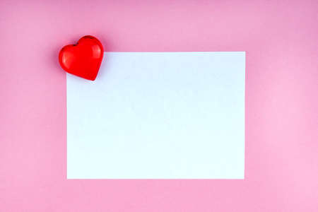 Love note with red heart on pink background mock up, copyspaceの写真素材