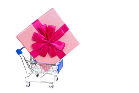 Great gift in the grocery shopping cart on a white backgroundの写真素材