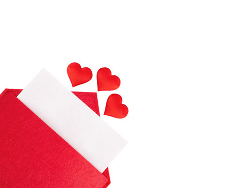 Red open envelope with a sheet of paper with a hearts on a isolated background with mock-up. Valentine's day holidays concept and love notes, christmas and new year letters for Santa Clausの写真素材