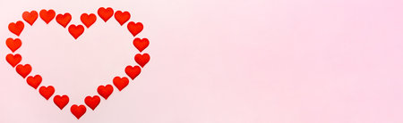 Banner big heart of small hearts mock-up on a pink background. Concept of holidays and Valentines Day.の写真素材
