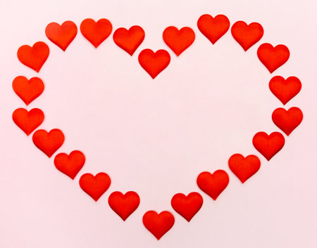 Big heart of small hearts with mock-up on a pink background. Concept of holidays and Valentines Day.の写真素材
