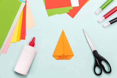 How to make Origami paper bookmark form of carrot for Easter greetings. Children's art project. DIY concept. Step by step photo instruction. Step 2の写真素材