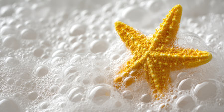 Yellow starfish immersing in abundant fluffy foam, creating a serene and clean aesthetic perfect for themes of relaxation, spa treatments, and refreshing cleanlinessの素材