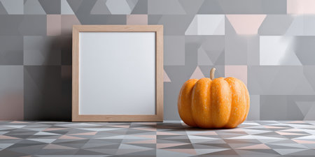 White blank frame standing on a geometrically patterned floor next to an orange pumpkin, creating a modern autumn still life scene suitable for halloween or thanksgiving promotional mockupsの素材