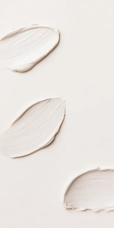 Cosmetic cream swatches show texture and pattern on a neutral background, highlighting beauty products and skincare concepts with a minimalist and elegant approachの素材