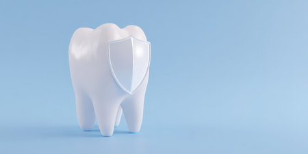 Tooth model standing on a light blue background, wearing a shield, visualizing comprehensive dental protection, oral hygiene, and preventive care concepts for healthy teethの素材