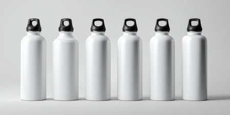 Six white aluminum reusable water bottles aligning in a clean row, ready for custom branding emphasizing sustainability, hydration, and eco-friendly lifestyle conceptsの素材