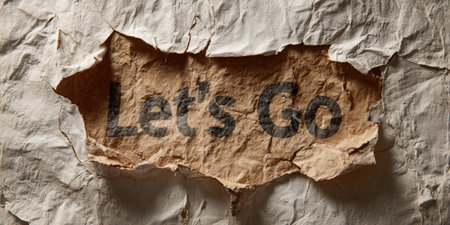 Torn textured beige paper revealing the let's go message printed on crumpled brown paper underneath, symbolizing motivation, challenge, new beginnings, or an urgent call to actionの素材