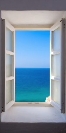 Open white window revealing a serene view of the vibrant blue ocean extending to the horizon under a bright, clear sky, symbolizing tranquility, escape, and summer vacationの素材