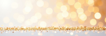 Sparkling golden bokeh lights create a festive and elegant backdrop, with a shimmering glittery surface below. Perfect for holiday celebrations and glamorous event designsの素材