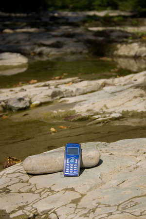 Mobile phone in nature surroundings.の写真素材