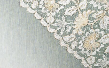White and gold lace on the fabric.