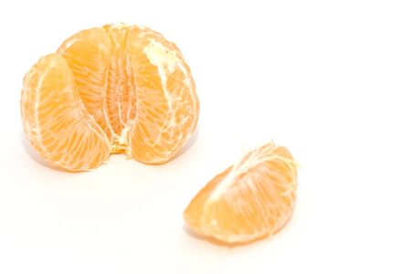 Peeled Tangerine isolated on a white background.の写真素材