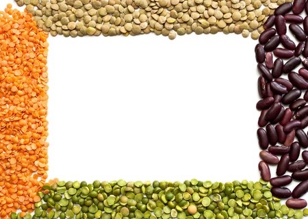 Multicolored mixed dried beans on a white background. Frame.