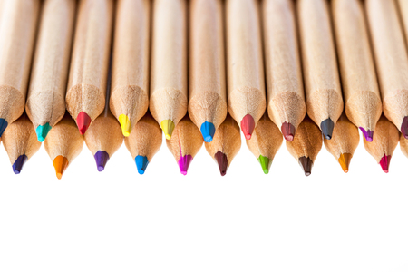 Different natural colored pencils on white background. Shallow depth of field.の写真素材