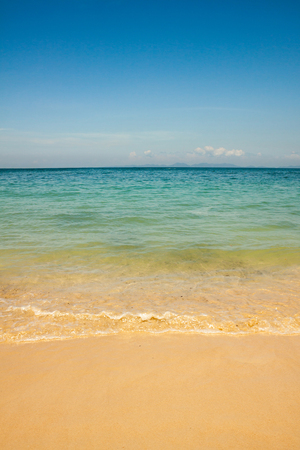 Beautiful amazing nature background. Tropical blue sea with boats and yellow beach.の写真素材