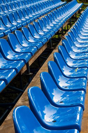 Rows of blue plastic stadium seats.の写真素材